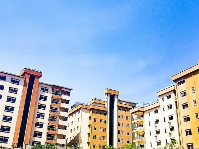 Colourful apartment blocks against a bright blue sky