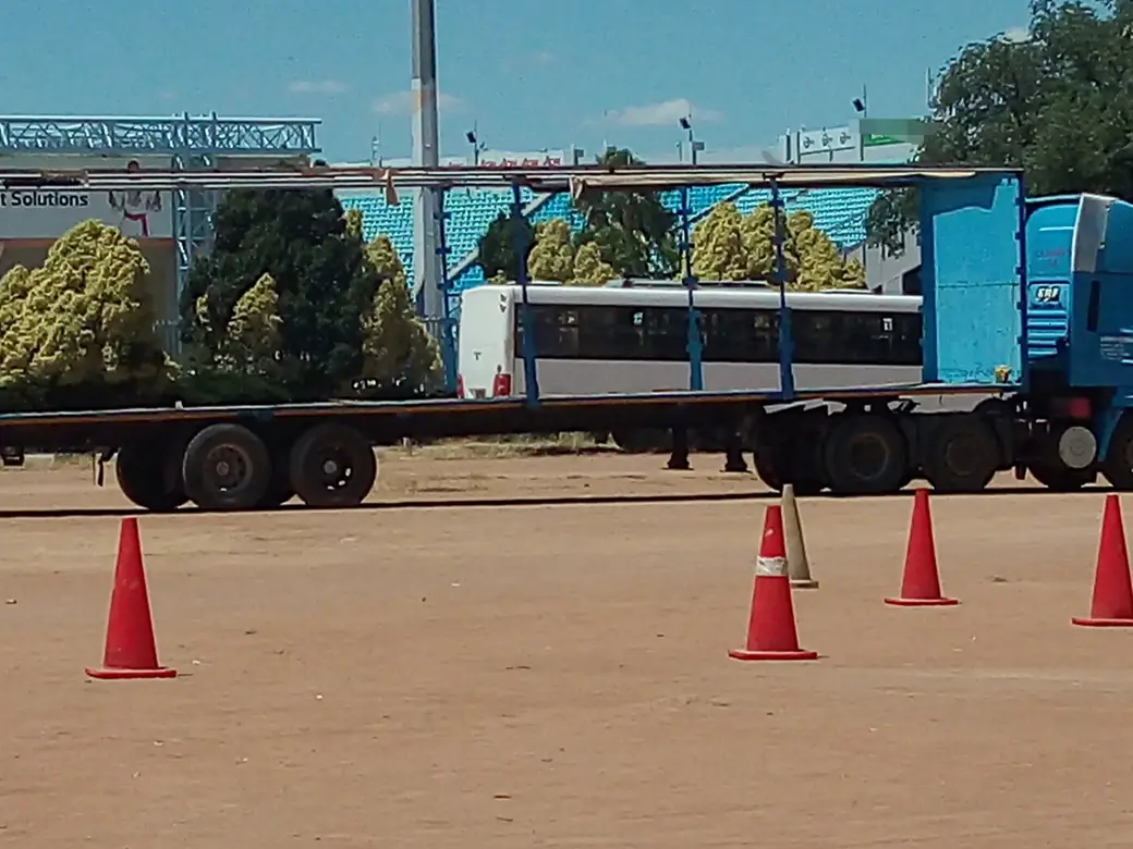 A driver training ground marked out with orange cones